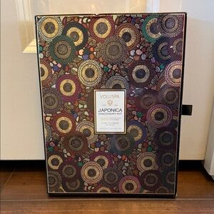 Voluspa Japonica Collection with Vibrant Patterns. 12 tiny tins candles